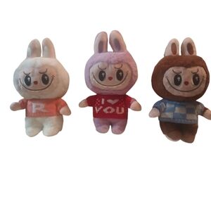 Adorable Stuffed Animal Trio - White, Purple, and Brown